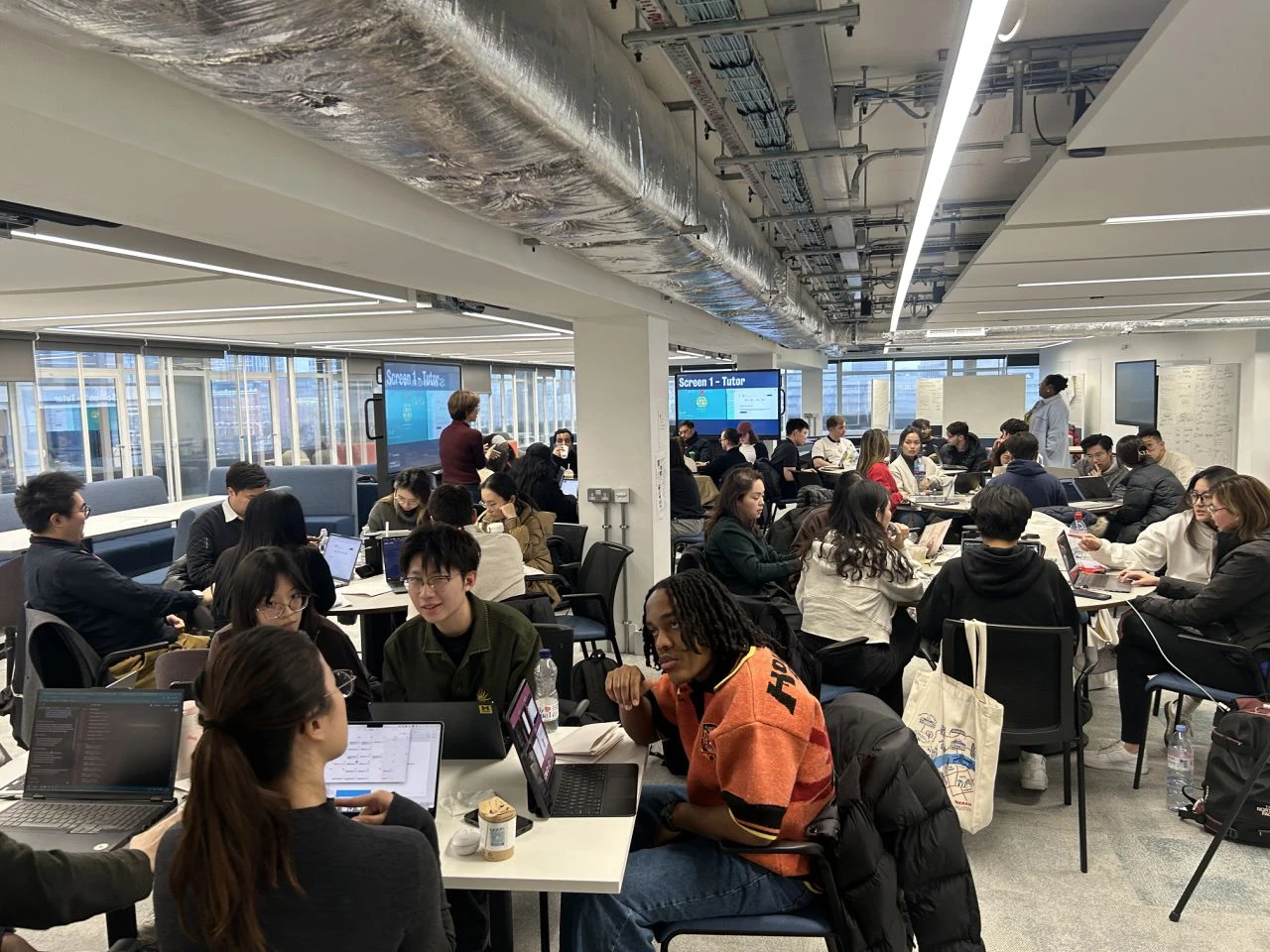 Teams building at laptops during a hands-on workshop at King's Business School